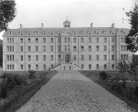 A black and white archive photograph of the college front