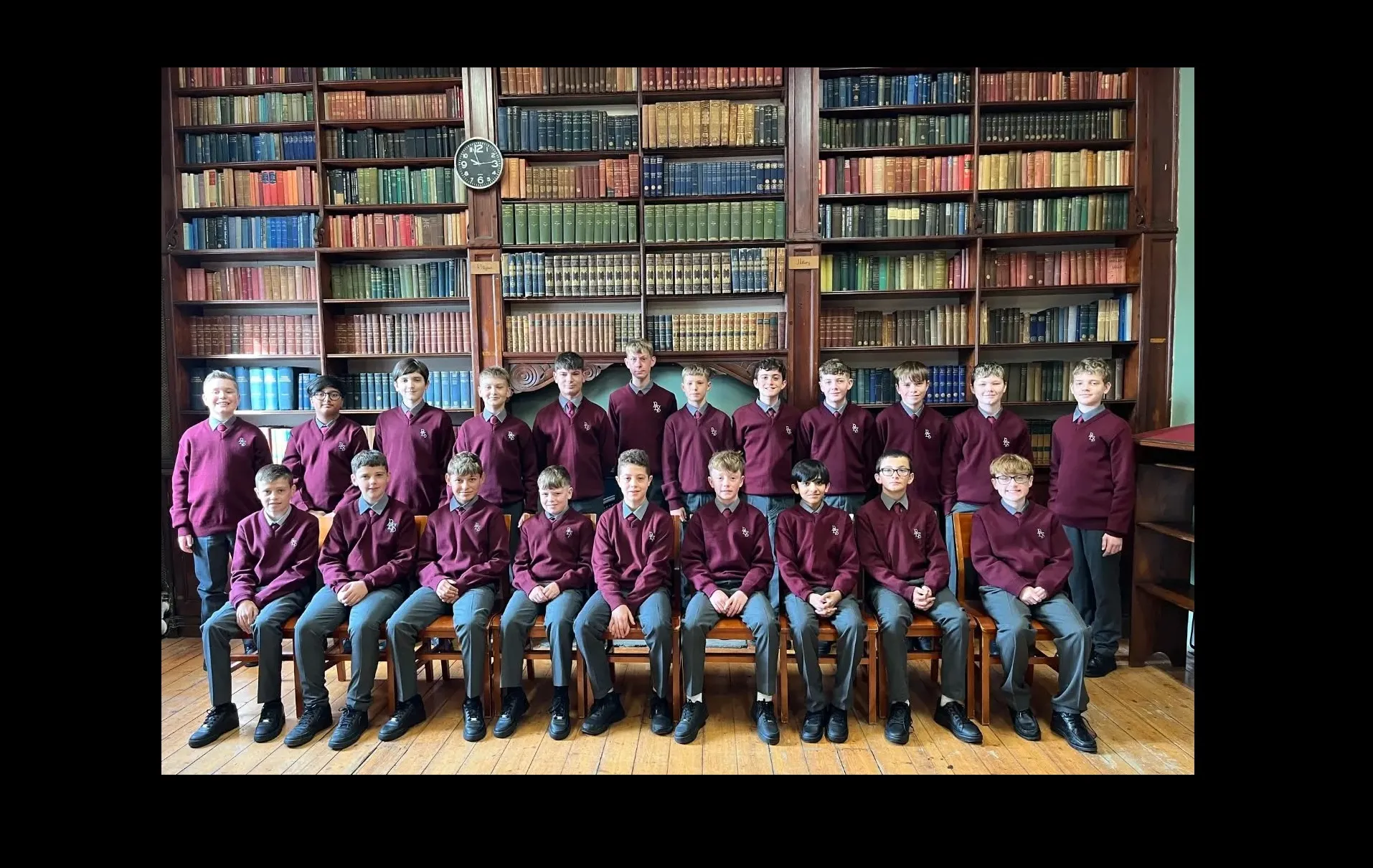 A class group photographed in the college library